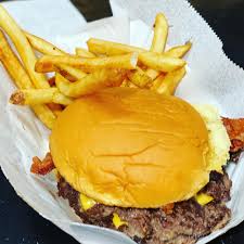 Hammered Cow signature dishes The Hammer BurgerMoo-MeltSriracha Bourbon Burger